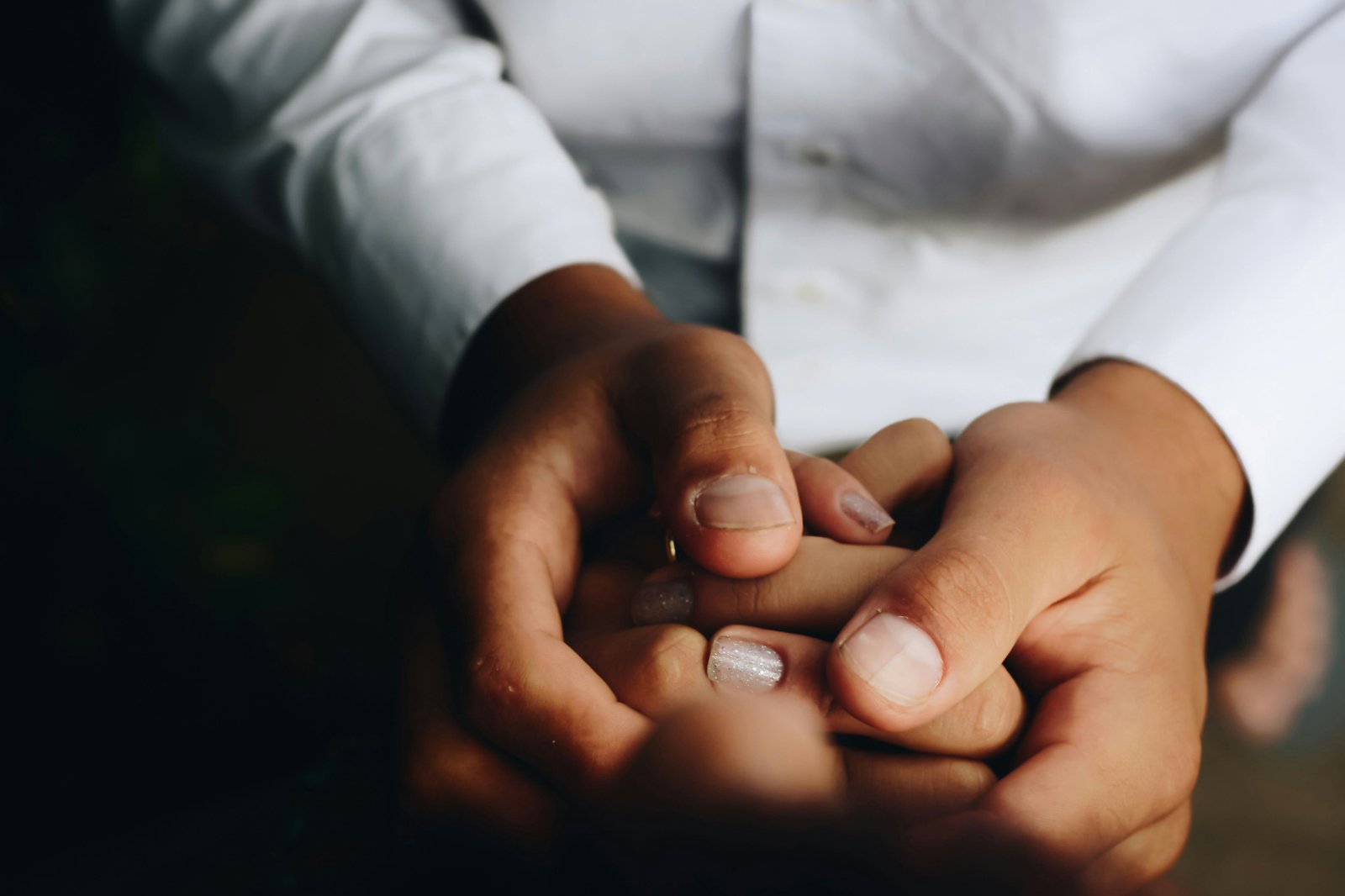 Hands joined in a gesture of care and solidarity
